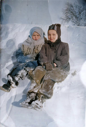 Julya (left) and Raisa.  Snowdrifts that winter were higher than the roofs of the houses.